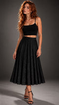 NOIR RHYTHM — JACQUARD PLEATED MIDI SKIRT